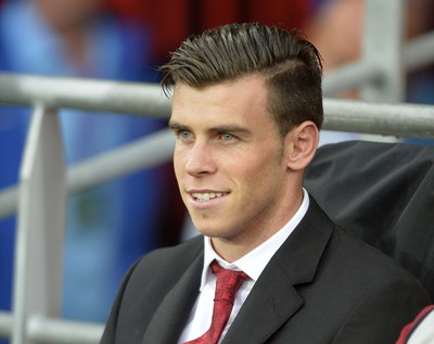 140813 - Wales v Republic of Ireland, International Friendly -   Gareth Bale of Wales takes his place on the bench before the match