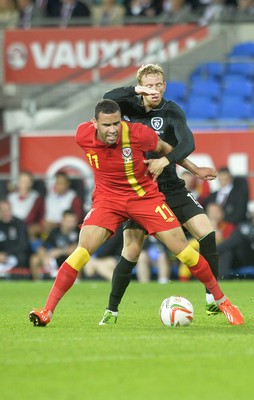 140813 - Wales v Republic of Ireland, International Friendly -  Hal Robson of Kanu of Wale, left, battles for the ball with Paul Green of Ireland