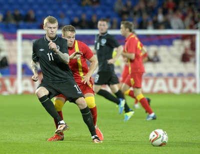 140813 - Wales v Republic of Ireland, International Friendly -  James McClean of Ireland, left, protects the ball from Chris Gunter of Wales