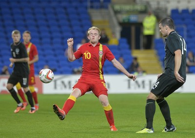 140813 - Wales v Republic of Ireland, International Friendly -  Jonathan Williams of Wales, left, is beaten by the pass by Darren O'Dea of Ireland
