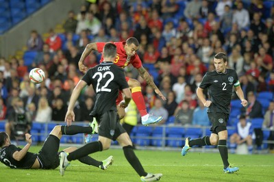 140813 - Wales v Republic of Ireland, International Friendly -  Craig Davies of Wales has his shot blocked by Marc Wilson of Ireland