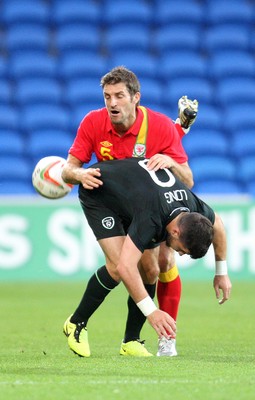 140813 - Wales v Republic of Ireland, Vauxhall International Friendly - Wales' Sam Ricketts puts Republic of Ireland's Shane Long under pressure