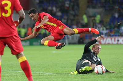 140813 - Wales v Republic of Ireland, Vauxhall International Friendly - Wales' Neil Taylor is tackled by Republic of Ireland's Paul Green