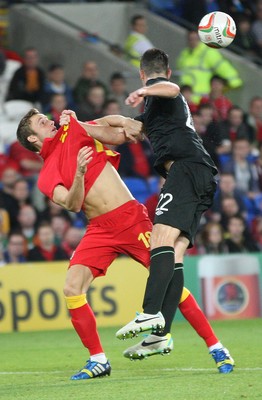 140813 - Wales v Republic of Ireland, Vauxhall International Friendly - Wales' Andy King tangles with Republic of Ireland's Ciaran Clark