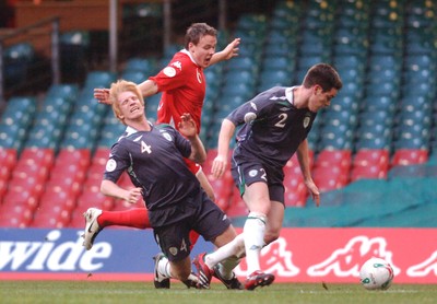 17.10.07 - Euro 2008 Qualifying Match, Group D Wales v Republic of Ireland Ireland's Paul McShane goes down as Wales' Chris Gunther challenges Steve Finnan 