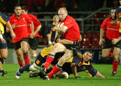 011102  Wales v RomaniaWales Tom Shanklin is tackled short of the line