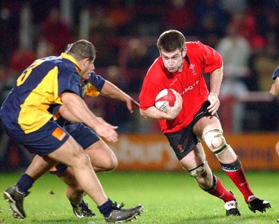 1-11-02 Wales v Romania  (Wrexham, The Racecourse)Wales' Michael Owen runs at Silviu  Florea
