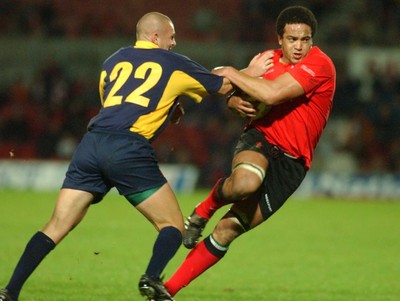 011102  Wales v RomaniaWales Gavin Thomas hands off Marius Coltuneac