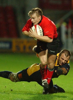 011102  Wales v RomaniaWales Dwayne Peel beats tackle by Florin Corodeanu