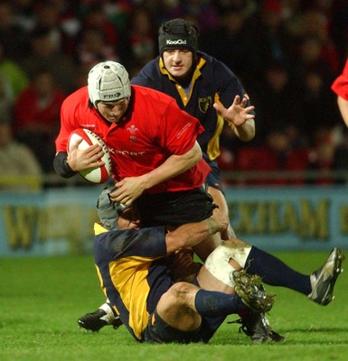 011102  Wales v RomaniaWales Gethin Jenkins is tackled by Romeo Gontineac