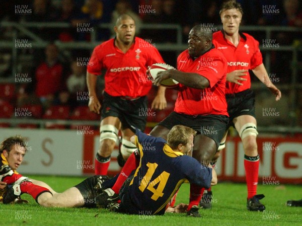 011102  Wales v RomaniaWales Martyn Madden is tackled by Vasile Ghioc
