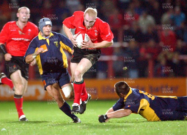 1-11-02 Wales v Romania  (Wrexham, The Racecourse)Wales' Tom Shanklyn avoids tackle by Florin Corodeanu (rt)