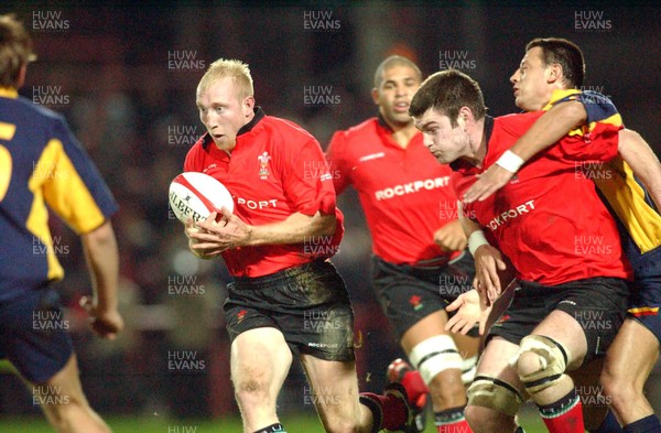 1-11-02 Wales v Romania  (Wrexham, The Racecourse)Wales' Tom Shanklyn advances with ball as Michael Owen is held off