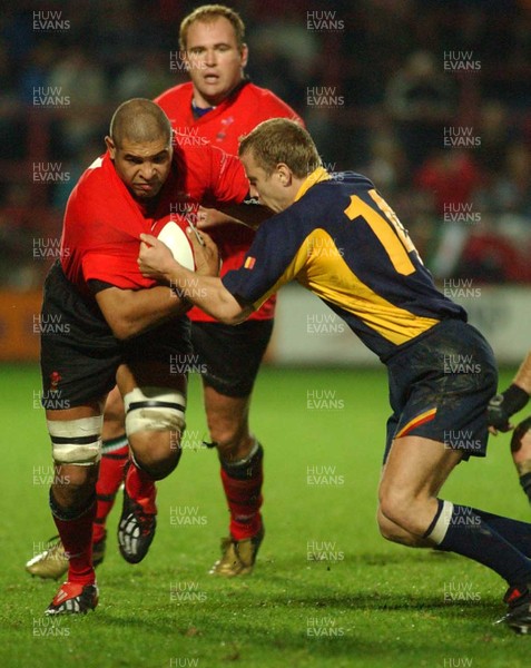 011102  Wales v RomaniaWales Colin Charvis is stopped by Vasile Ghioc