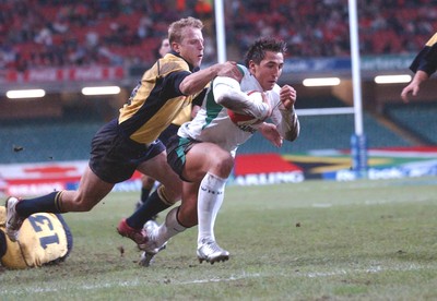 12-11-04. Wales v Romania.  Wales' Gavin Henson dives over to score try despite tackle from Vasile Ghioc  