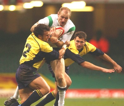 12.11.04 Wales v Romania  Wales Gareth Thomas is tackled by Romeo Gontineac  