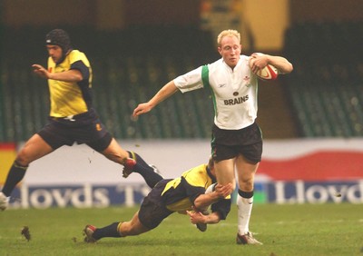 12.11.04 Wales v Romania  Wales Tom Shanklin beats tackle by Vasile Ghioc  