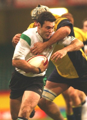 12.11.04 Wales v Romania  Wales Stephen Jones is tackled by Cristian Petre.  