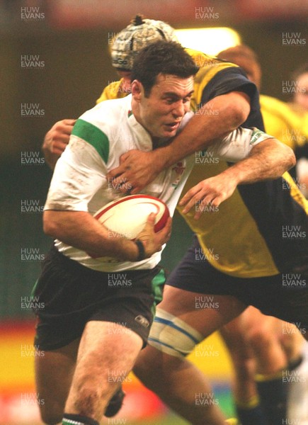 12.11.04 Wales v Romania  Wales Stephen Jones is tackled by Cristian Petre.  
