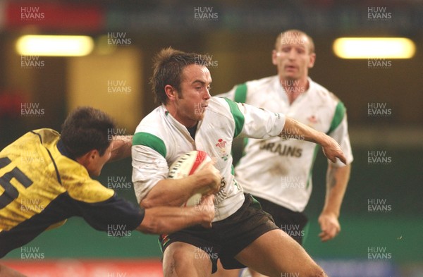 12.11.04 Wales v Romania  Wales Rhys Williams brushes offValentin Maftei  