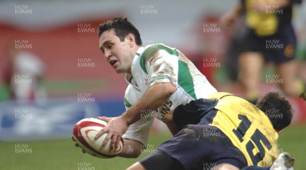 12-11-04. Wales v Romania.  Wales' Stephen Jones scores despite tackle from Valentin Maftei  