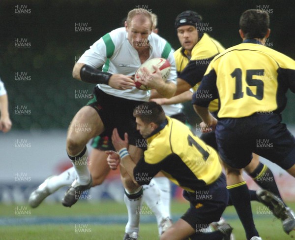 12-11-04. Wales v Romania.  Wales' Gareth Thomas brushes off Cristian Sauan  