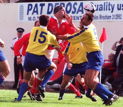 300897 - Wales v Romania - Mark Rowley of Wales takes on Valentin Maftei and Vasile Nedelcu