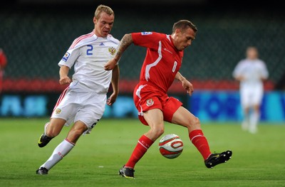 09.09.09 -  Wales v Russia - World Cup 2010 Qualifier Group Four - Craig Bellamy of Wales is challenged by Alexander Anyukov of Russia. 