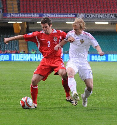 09.09.09 - World Cup Qualifying Group 4 Wales v Russia Wales' Sam Ricketts is challenged by Russia's Renat Yanbaev  