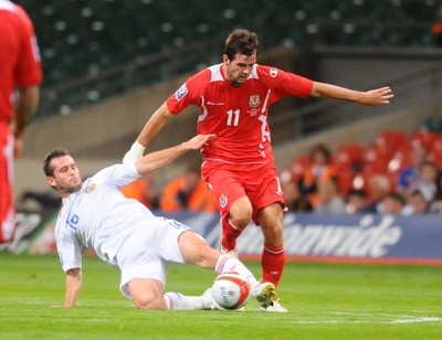 09.09.09 - World Cup Qualifying Group 4 Wales v Russia Wales' Joe Ledley is tackled by Russia's Alexander Kerzhakov 