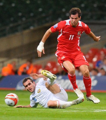 09.09.09 - World Cup Qualifying Group 4 Wales v Russia Wales' Joe Ledley is tackled by Russia's Alexander Kerzhakov 