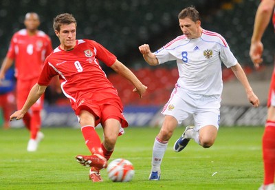 09.09.09 - World Cup Qualifying Group 4 Wales v Russia Wales' Aaron Ramsey is challenged by Russia's Igor Semshov  