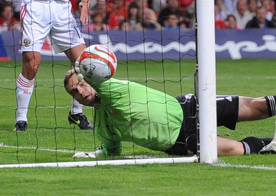 09.09.09 - World Cup Qualifying Group 4 Wales v Russia Russia's keeper Igor Akinfeev fails to keep a shot from Wales' James Collins  out of his net 