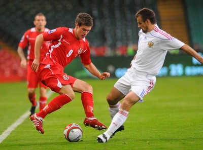 09.09.09 - World Cup Qualifying Group 4 Wales v Russia Wales' Aaron Ramsey is challenged by Russia's Serget Semak  