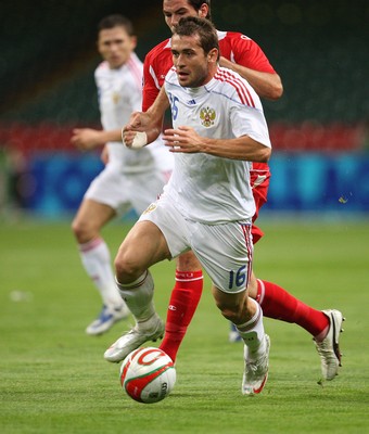 09.09.09 Wales v Russia... Russia's Alexander Kerzhakov taking on Wales' Joe Ledley . 