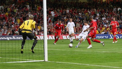 09.09.09 Wales v Russia... Russia's Igor Semshov scoring goal past Wales' keeper Wayne Hennessey . 