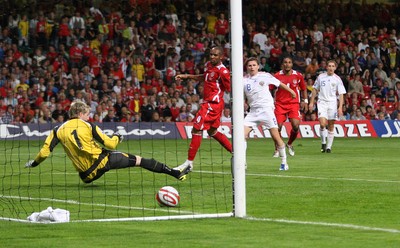 09.09.09 Wales v Russia... Russia's Igor Semshov scoring goal past Wales' keeper Wayne Hennessey . 