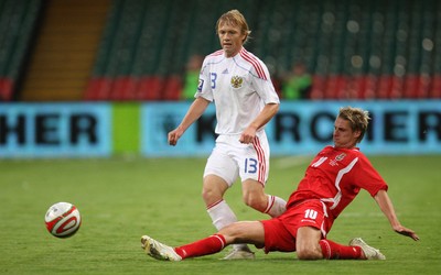 09.09.09 Wales v Russia... Russia's Renat Yanbaev being tackled by Wales' David Edwards  . 