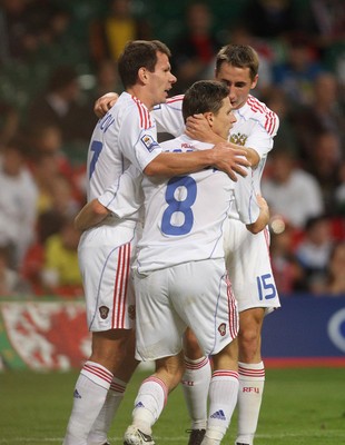 09.09.09 Wales v Russia...  Russia's Igor Semshov being congratulated by Konstantin Zyryanov  and Vladimir Bystrov (R)  . 