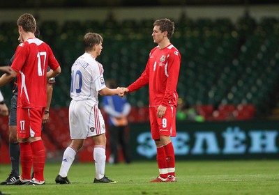 09.09.09 Wales v Russia... Russia's Andrey Arshavin shaking hands with Arsenal teammate Wales' Aaron Ramsey  . 