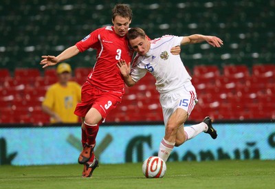 09.09.09 Wales v Russia... Russia Vladimir Bystrov holding off Wales' Chris Gunter. 