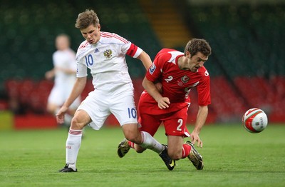 09.09.09 - Wales v Russia, World Cup Qualifying Group 4 -  Russia's Andrey Arshavin tangles with Wales' Sam Ricketts  