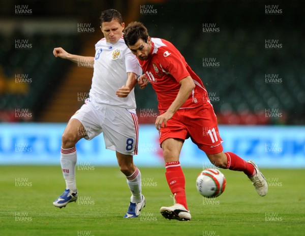 09.09.09 -  Wales v Russia - World Cup 2010 Qualifier Group Four - Joe Ledley of Wales is challenged by Igor Semshov of Russia. 
