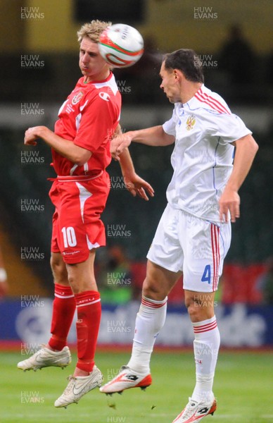 09.09.09 - World Cup Qualifying Group 4 Wales v Russia Wales' David Edwards beats Russia's Sergei Ignashevich to a high ball 