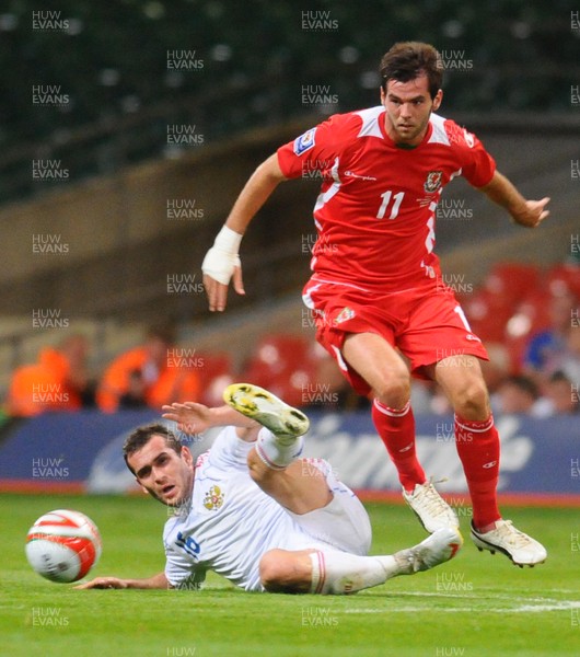 09.09.09 - World Cup Qualifying Group 4 Wales v Russia Wales' Joe Ledley is tackled by Russia's Alexander Kerzhakov 