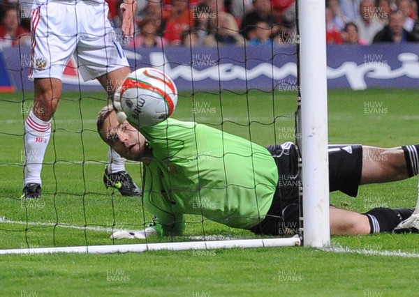 09.09.09 - World Cup Qualifying Group 4 Wales v Russia Russia's keeper Igor Akinfeev fails to keep a shot from Wales' James Collins  out of his net 
