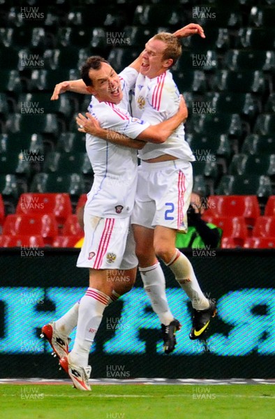 09.09.09 - World Cup Qualifying Group 4 Wales v Russia Russia's Sergei Ignashevich  (L) celebrates with Alexander Anyukov after scoring his sides second goal 