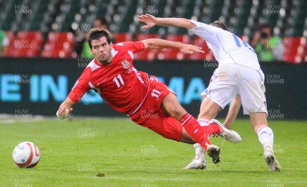 09.09.09 - World Cup Qualifying Group 4 Wales v Russia Wales' Joe Ledley is brought down by Russia's Alexander Kerzhakov 