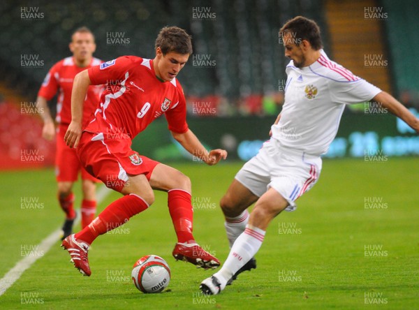 09.09.09 - World Cup Qualifying Group 4 Wales v Russia Wales' Aaron Ramsey is challenged by Russia's Serget Semak  
