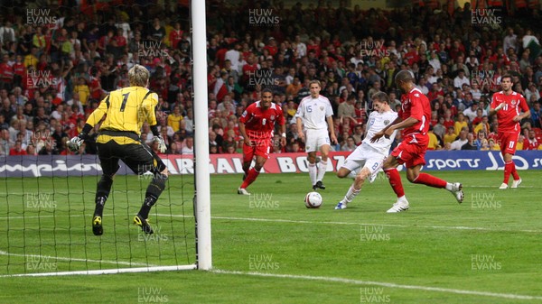 09.09.09 Wales v Russia... Russia's Igor Semshov scoring goal past Wales' keeper Wayne Hennessey . 